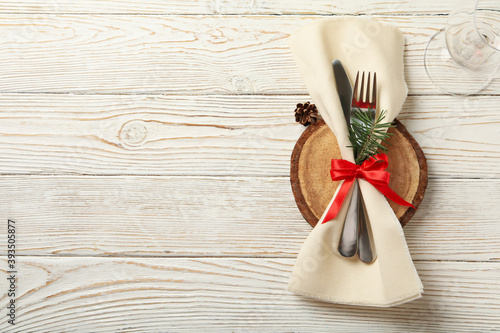 Napkin with New year cutlery on wooden background