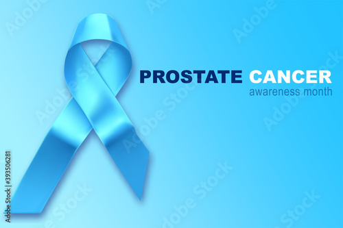 Blue ribbon. Awareness of men health in November with blue prostate cancer ribbon on blue background. Symbol of oncology affected man. Copy space.