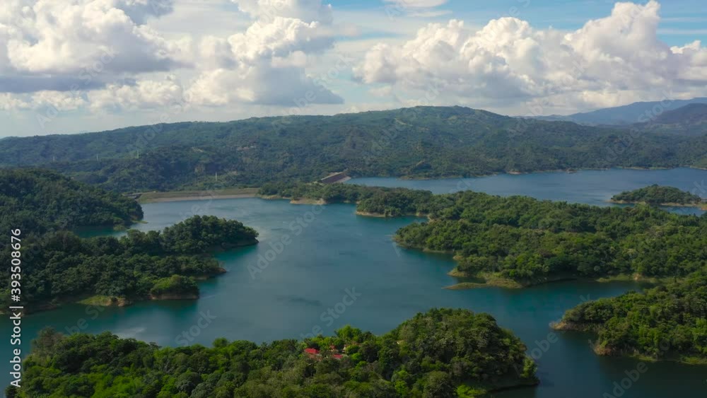 Blue Pantabangan Lake among the green mountains covered with green forests. Philippines, Luzon. Blue Pantabangan Lake among the green mountains covered with green forests. Philippines, Luzon.