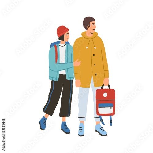 Young happy romantic couple during traveling. Modern man and woman in warm clothes with backpacks hiking together. Tourist characters isolated on white background. Colorful flat vector illustration
