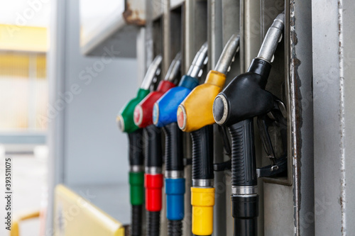 Fuel pistols at the gas station. Close-up. Oil industry.