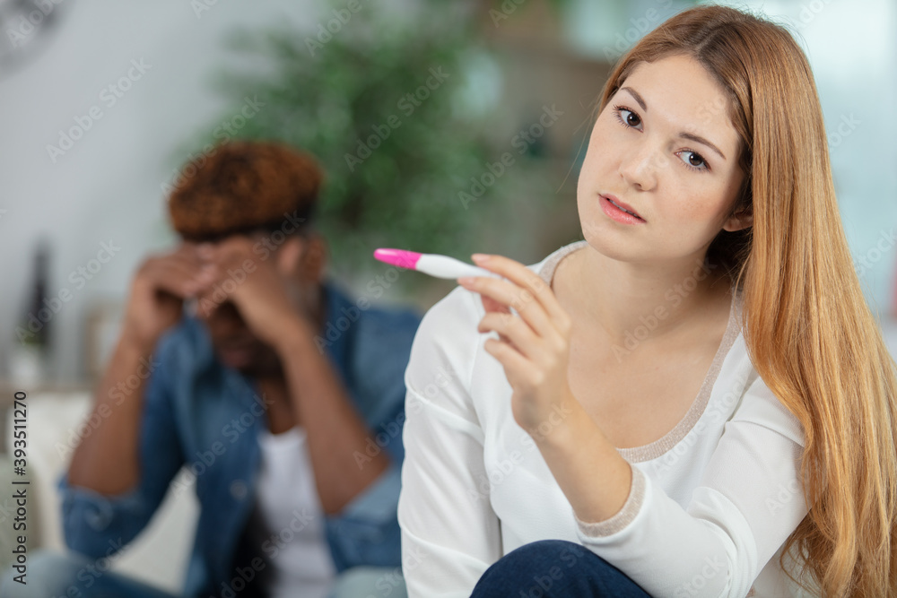 distressed couple finding out results of a pregnancy test distressed couple finding out results of a pregnancy test