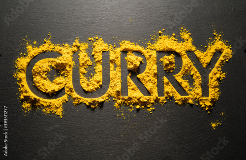 Wallpaper Mural Word "Curry" from dry curry powder on black background. Torontodigital.ca