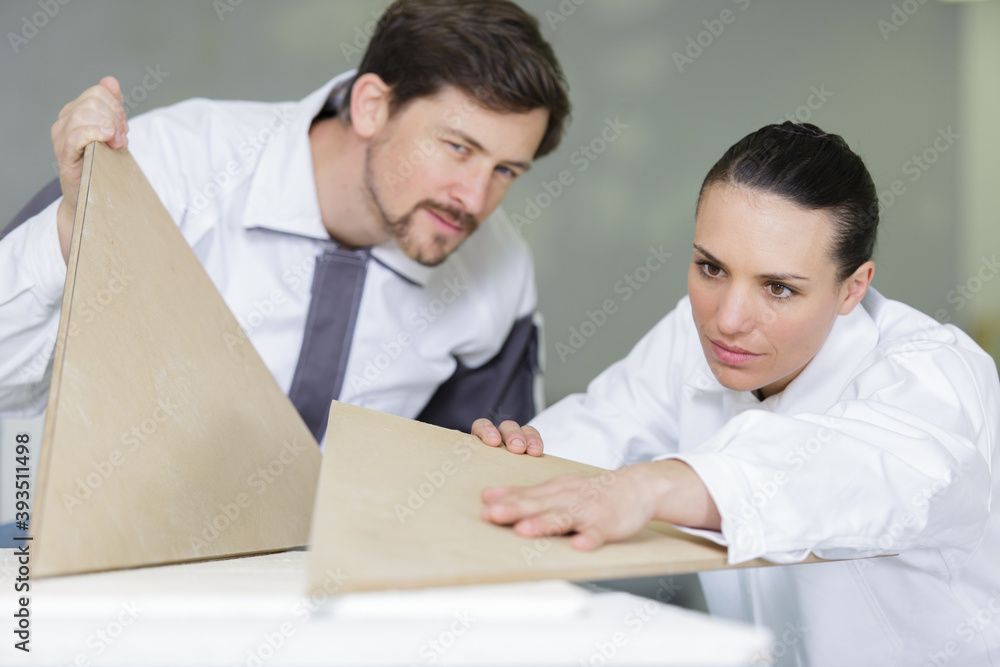 carpenters work with wood boards carpenters work with wood boards