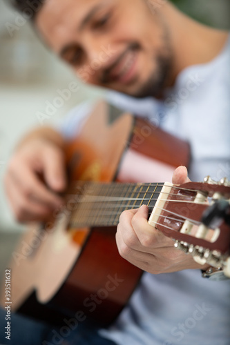 a man is practicing guitar