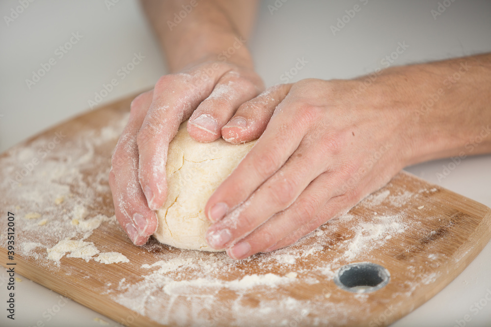 hands wrapped around dough