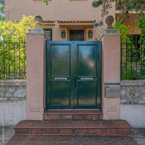 contemporary house entrance metallic door and fence, Athens Greece