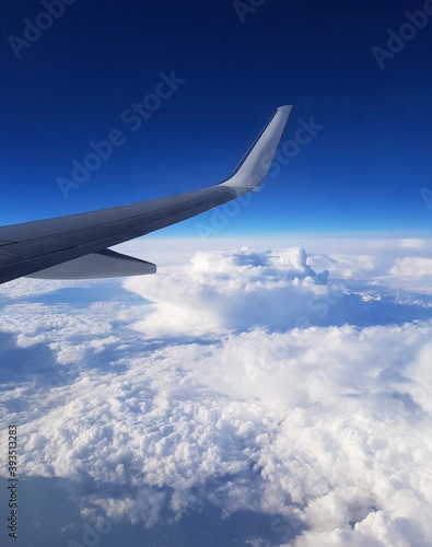 view of the clouds through the porthole