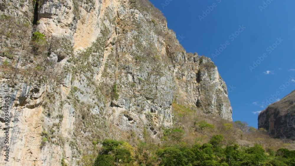 Steep Cliff rock face walls of Sumidero Canyon National Park In Chiapas Mexico.Slow dolly shot.
Steep Cliff rock face walls of Sumidero Canyon National Park In Chiapas Mexico.Slow dolly shot.