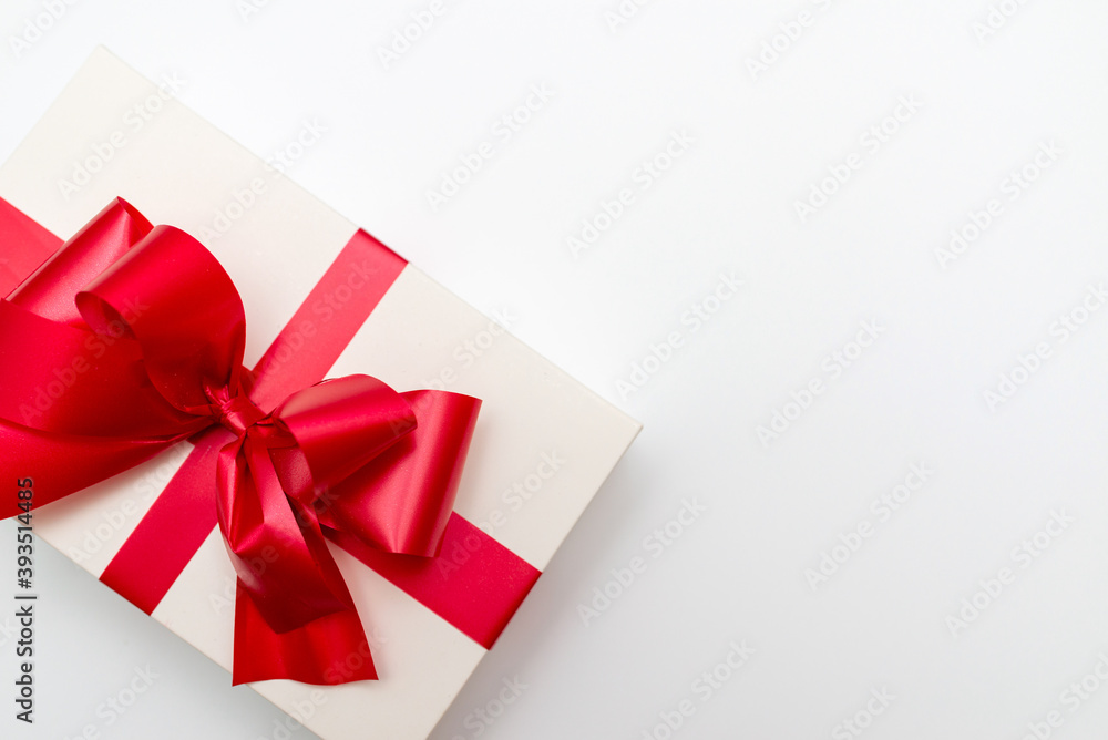 Top view Cristmas white gift box present red bow white background. Top view Cristmas white gift box present red bow white background.
