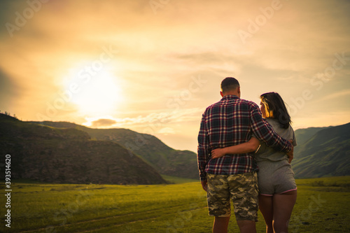 couple walking on the mountain meadow