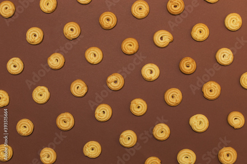 Butter biscuits on brown background