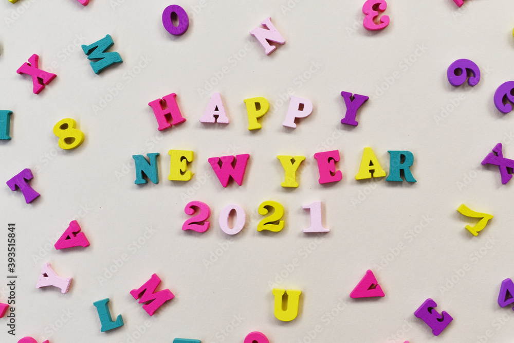 Fototapeta premium Happy new year 2021 concept with colorful wooden text flat lay