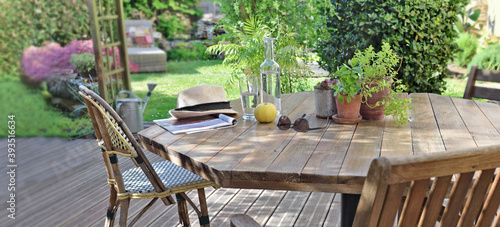 Fotografie, Obraz table with drink and apple in a wooden terrace in countryside house for relaxati