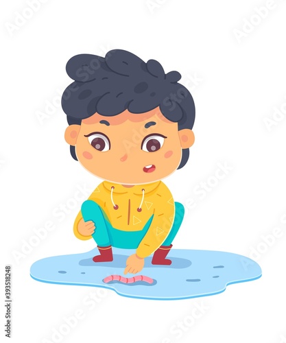 Boy touching worm in puddle. Sense of touch vector illustration. Small happy child standing in nature and touching worm with finger. Joyful education at childhood. Cute smiling kid