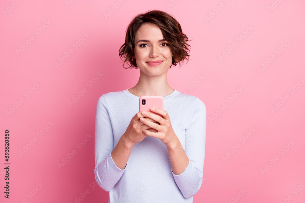 Portrait of addicted blogger girl use smartphone wear sweater isolated over pastel color background Portrait of addicted blogger girl use smartphone wear sweater isolated over pastel color background
