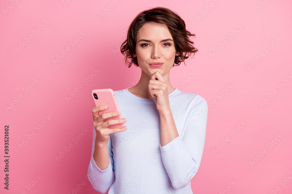 Portrait of smart creative girl blogger use smartphone wear jumper isolated over pastel color background Portrait of smart creative girl blogger use smartphone wear jumper isolated over pastel color background