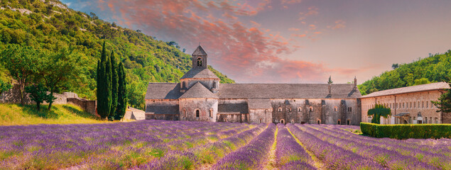 Leinwandbilder Honigfarbe Notre-dame De Senanque Abbey, Vaucluse, France. Beautiful Landscape Lavender Field And An Ancient Monastery Abbaye Notre-dame De Senanque. Elevated View, Panorama. Altered Sunset Sky  © Great Brut Here