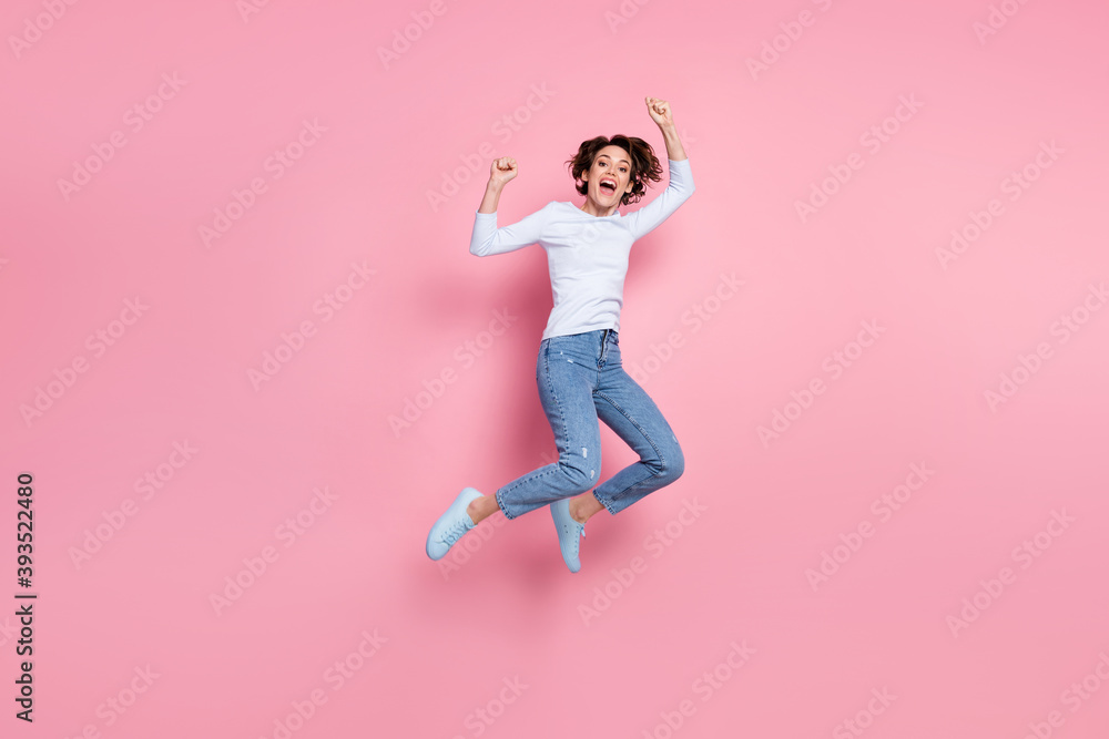 Full body photo girl jump discount lucky win scream raise fists wear white sweater isolated pink color background