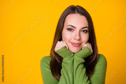Close-up portrait of lovely cute calm content girl resting enjoying serenity isolated over bright yellow color background © deagreez