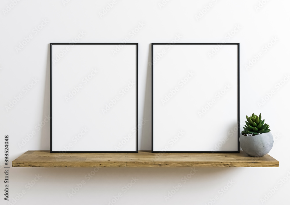 Two Vertical 8x10 Black Frame mockup. Vertical Black frame on a wooden shelf with plant in a concrete vase. Two Vertical 8x10 Black Frame mockup. Vertical Black frame on a wooden shelf with plant in a concrete vase.