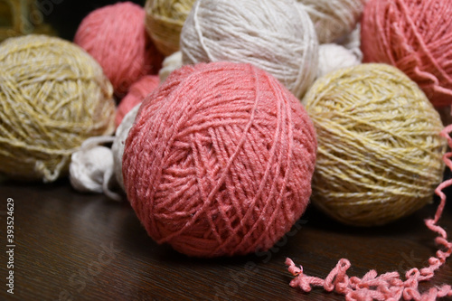 Tangles of yarn of different sizes and colors. Yarn for reuse