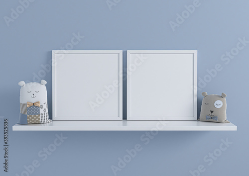 Two square white frame mockups for nursery or kids room on white shelf with toys. Children room nursery mockup frame poster on clean blue wall.