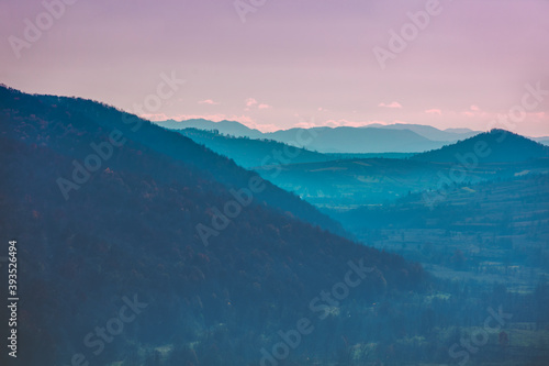 Autumn in the mountains. View of the mountains ridge at sunset. Beautiful nature landscape. Carpathian mountains. Zakarpattia Oblast, Ukraine © vvvita