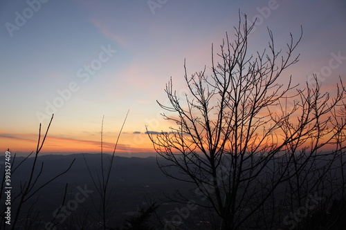 fascinating sunset  colorful sky  horizon on the landscape of Gubbio. Silhouette of bare trees in the winter season