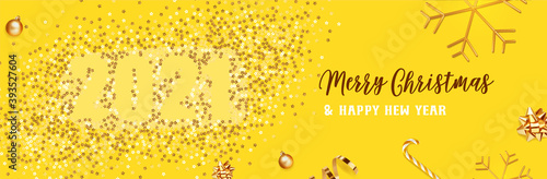 Merry Christmas and Happy New Year. Background Xmas design of Christmas caramel, realistic golden snowflakes and glitter golden confetti, bauble ball. 2021 vector illustration on yellow background.