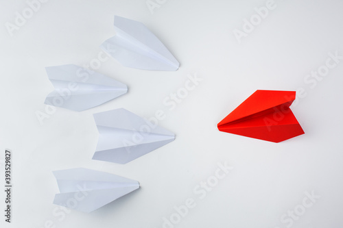 Paper airplane, leadership and individuality concept