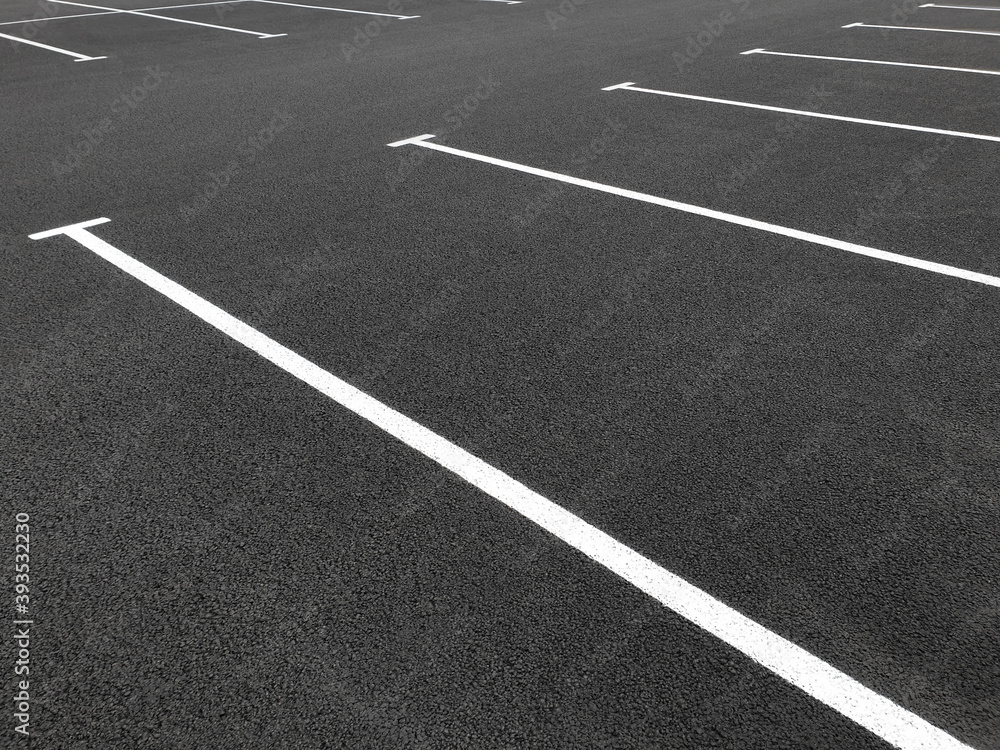 Parking markings, black and white stripes on bitumen. Empty Parking space at store