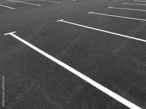 Parking markings  black and white stripes on bitumen. Empty Parking space at store