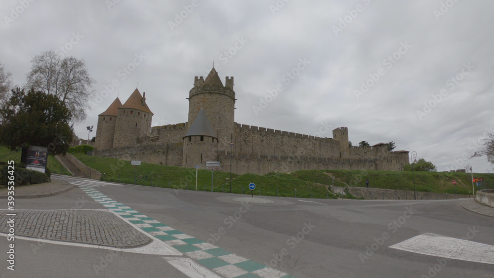 Carcassonne / France - March 15, 2020: The Cité de Carcassonne is a medieval citadel in the department of Aude, Occitanie region. It is located on a hill on the right bank of the River Aude.