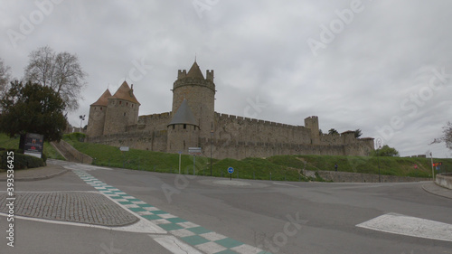 Carcassonne / France - March 15, 2020: The Cité de Carcassonne is a medieval citadel in the department of Aude, Occitanie region. It is located on a hill on the right bank of the River Aude. photo