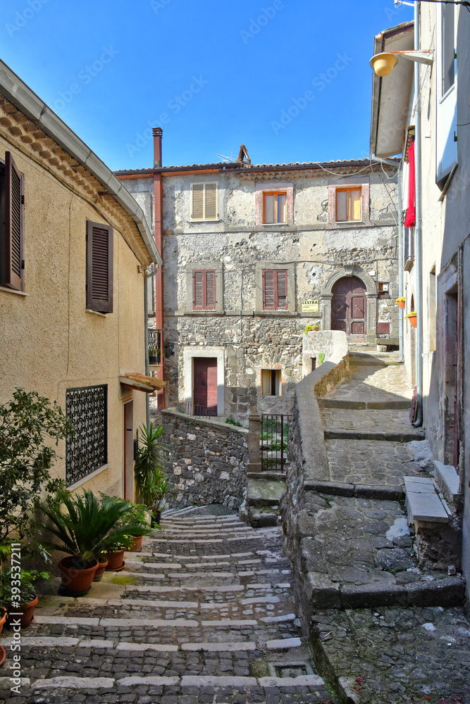 A narrow street among the old houses of Patrica, a medieval village in the Lazio region, Italy.
