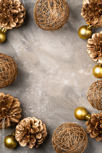 Christmas composition with copy space. Golden ornament, pine cones decorations. Mock up greetings card template