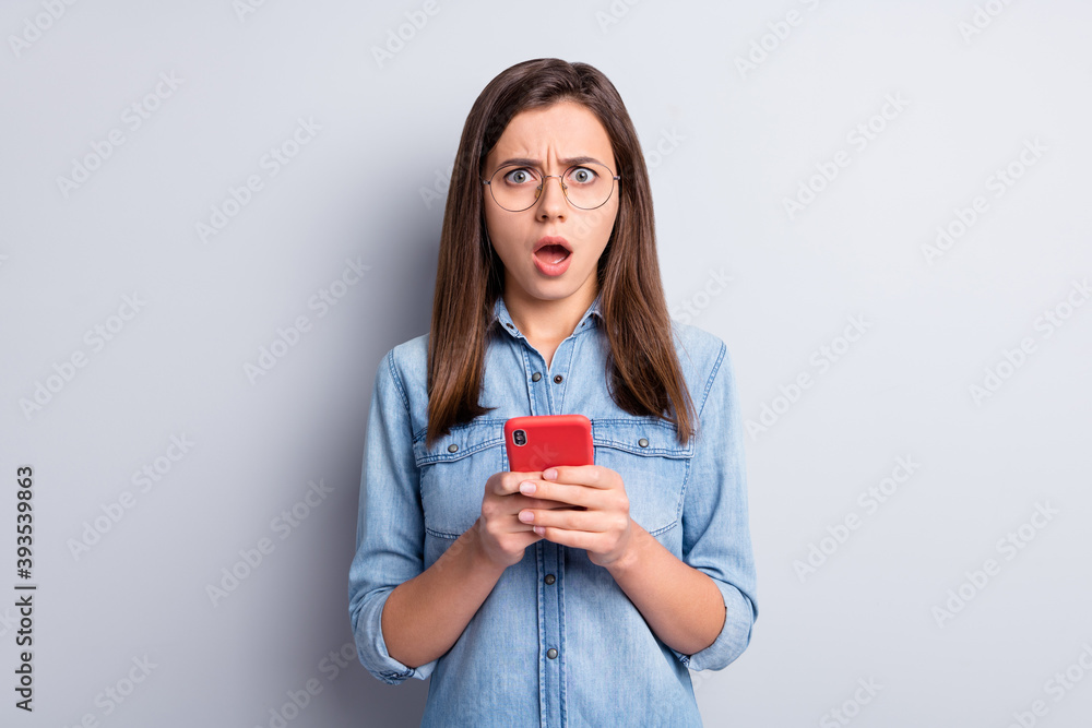 Portrait of attractive questioned blogger staring open mouth unexpected isolated on grey color background Portrait of attractive questioned blogger staring open mouth unexpected isolated on grey color background