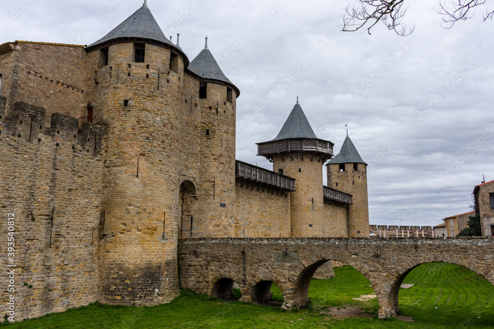 The Château Comtal - entrance from the Cité of Carcassonne, France. The chateau of the Counts of Carcassonne and the ramparts, a UNESCO World Heritage site located at the heart of the fortified city.
