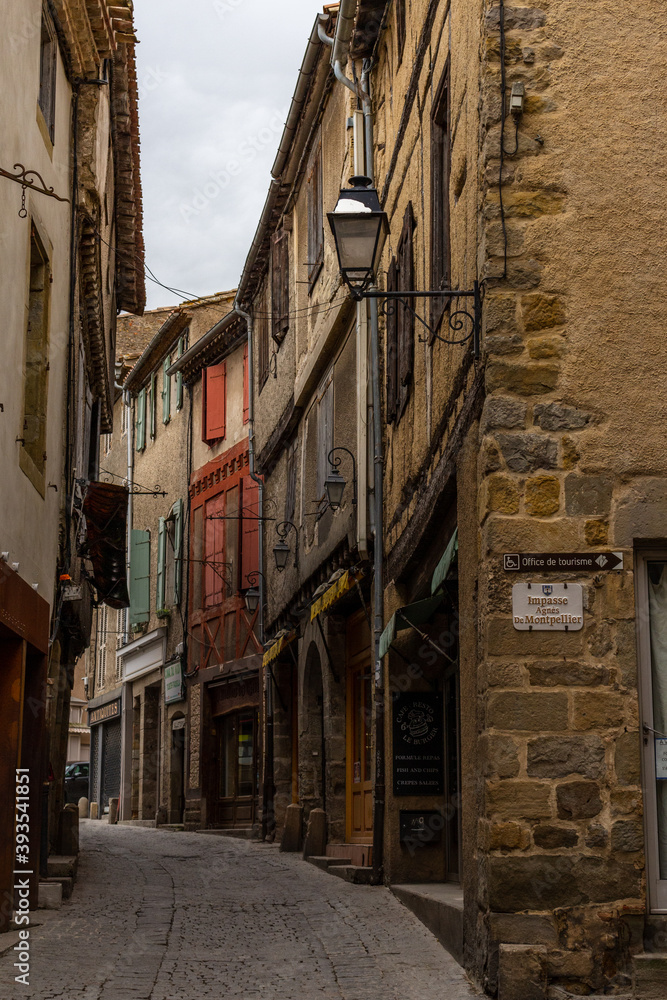 Carcassonne / France - March 15, 2020: La Cité de Carcassonne and its narrow medieval streets. View of Rue Cros Mayrevieille Street.