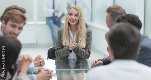 young business woman discusses her ideas with a business team.