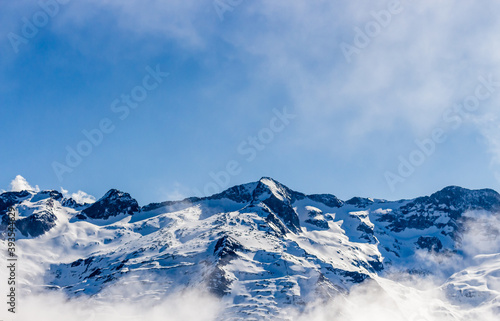 Snow and mountain peaks in the french Pyrenees near the Luchon Superbagn  res Ski Resort in the Arrondissement of Saint-Gaudens  Occitania  Haute-Garonne  France. The Luchonnais Mountains aerial view.
