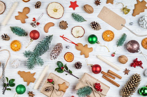 Christmas set collection, background with decorations. Christmas gift, pine cones, fir branches, gingerbreads on white wooden background. Concept on Christmas topic. Retro style.