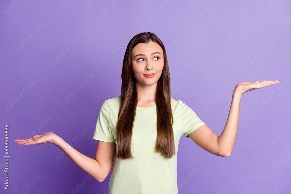 Portrait of pretty lady two palms hold products demonstrate better look empty space isolated on purple color background Portrait of pretty lady two palms hold products demonstrate better look empty space isolated on purple color background