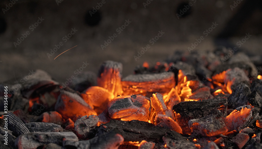 Burning charcoal on a barbecue. Glowing ashes with embers. Burning charcoal on a barbecue. Glowing ashes with embers.