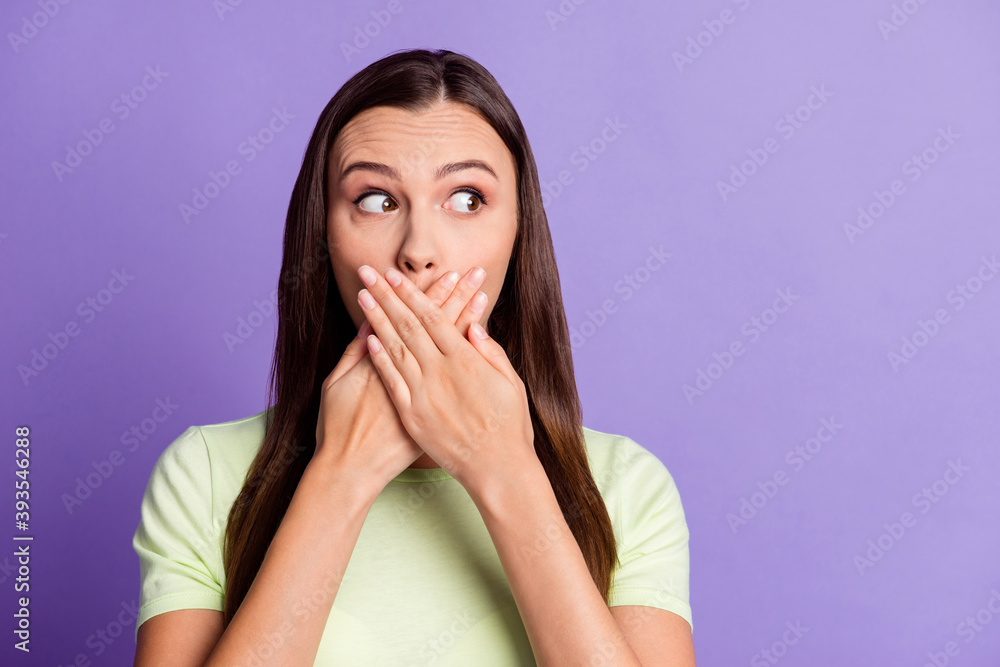 Photo of impressed lady look empty space hands palms covering mouth lips isolated on violet color background Photo of impressed lady look empty space hands palms covering mouth lips isolated on violet color background