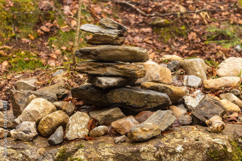 Balanced cairn or troll stoned pyramid, tourist memory sign or hiking path marking at the Valley Val d’Astau, southwest of Bagneres de Luchon in the French Pyrenees. The trail to Lake d'Oô, France. Balanced cairn or troll stoned pyramid, tourist memory sign or hiking path marking at the Valley Val d’Astau, southwest of Bagneres de Luchon in the French Pyrenees. The trail to Lake d'Oô, France.