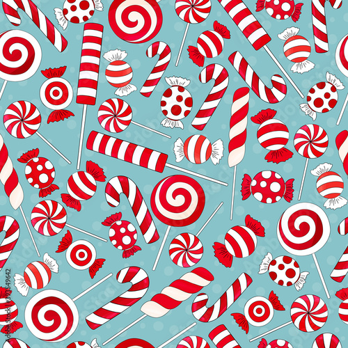 Candy cane pattern. Many types christmas treats on blue background. Traditional red and white xmas ans new year lollypop. Striped candies on snow 

backdrop. Tasty, hand drawn delicious holiday print.