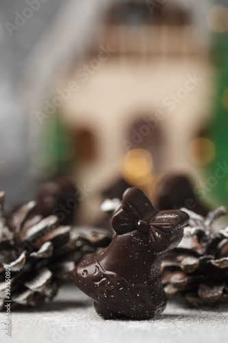 Fototapeta Naklejka Na Ścianę i Meble -  Christmas chocolates. Chocolate figurines-Santa Claus, hare, horse, dragon, bell