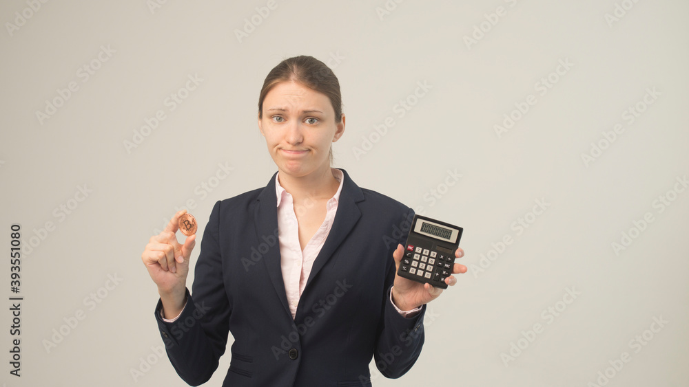 Woman holding a physical bitcoin cryptocurrency in her hand Woman holding a physical bitcoin cryptocurrency in her hand